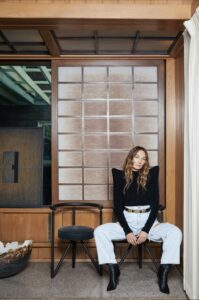 Portrait of interior designer Kelly Wearstler, captured by The Ingalls, showcasing her style and personality in the elegant setting of her Surf Shack in Malibu.